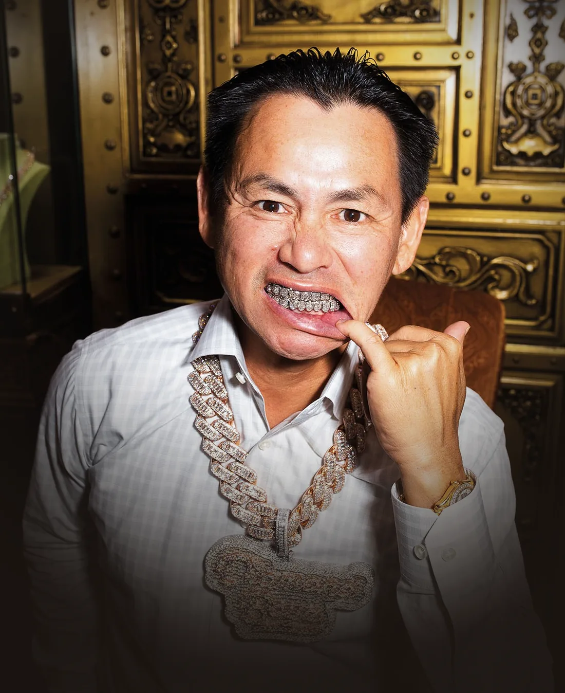 Johnny Dang, Houston icon, showing a custom diamond grill and wearing diamond chains